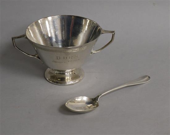 A George V silver two handled porringer and rat tail spoon.